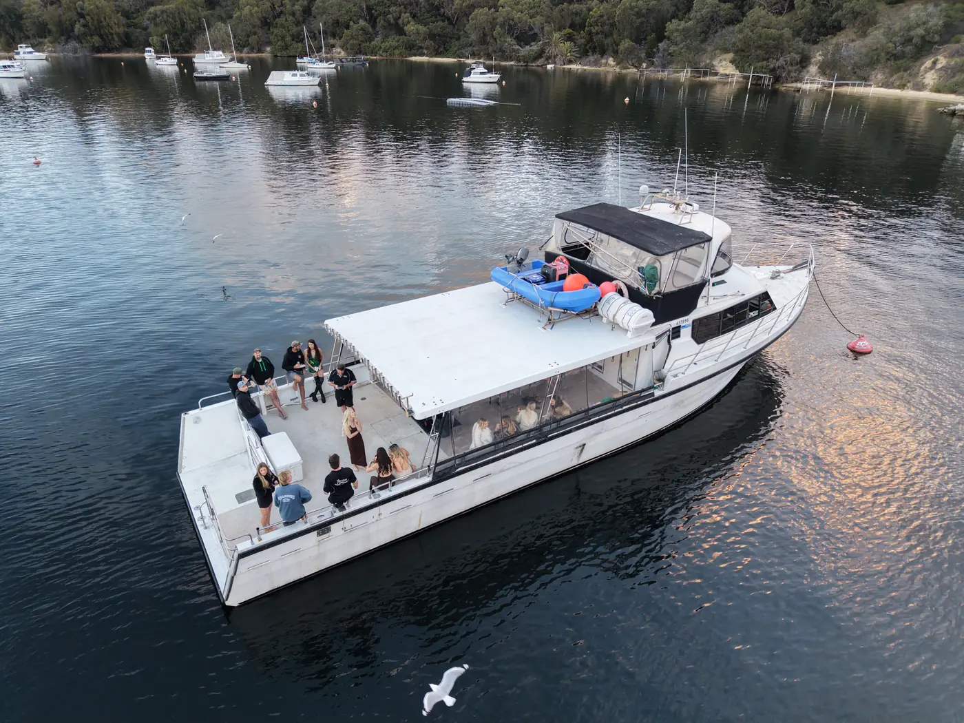 A party on the back deck of Aussie Warrior, moored on the Swan River